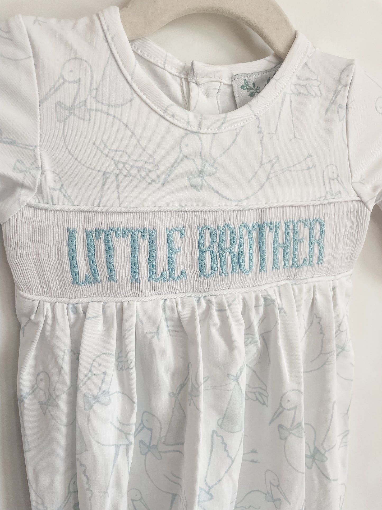 Storks Newborn Smock "Little Brother"
